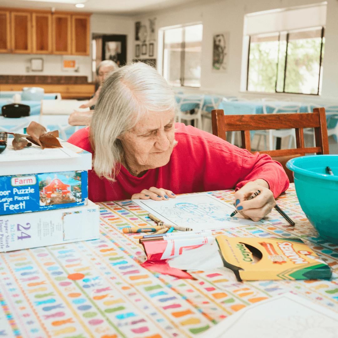 Resident doing arts and crafts activity